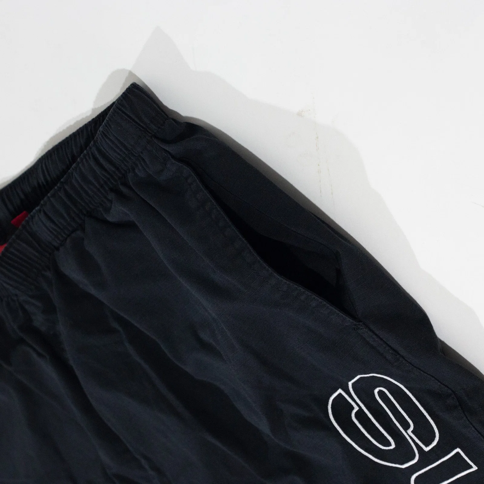 Calça Supreme Spellout Embroidered — foto 7